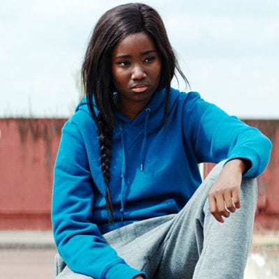 A young woman in a hoody.