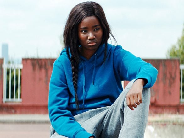 A young woman in a hoody.