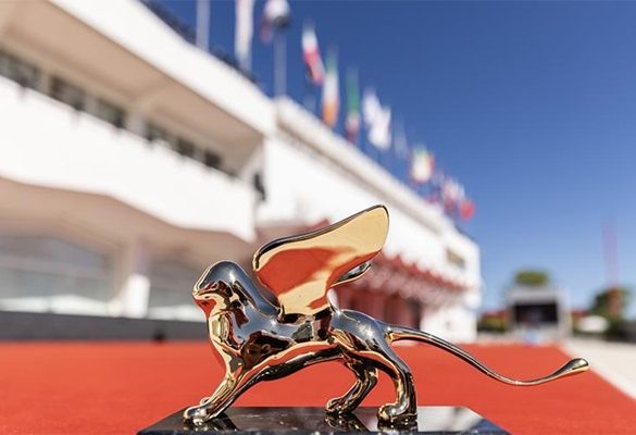 Venice Film Festival gold mascot infront of the red carpet entrance